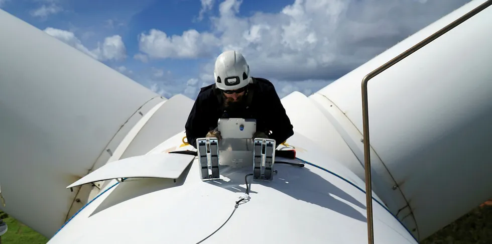 NRG Systems technician installing a bat deterrent system