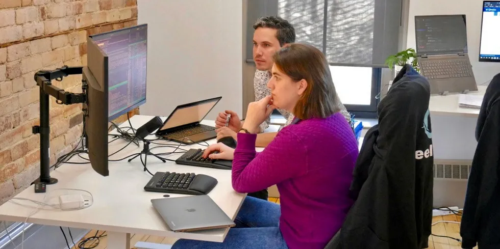 Mathew Zimola, CEO of ReelData (right) with a member of the ReelData team in the Halifax office.