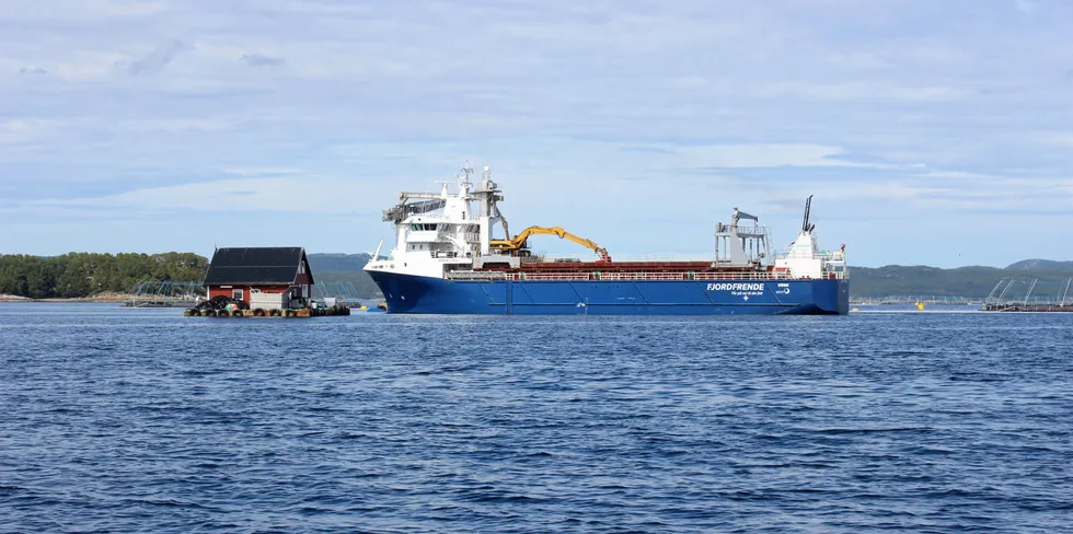 A barge transports feed to a Leroy Seafood salmon farm in Trondelag, Norway.