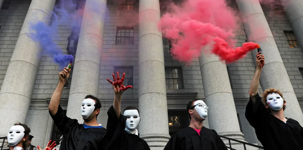 Climate activists, including members of Extinction Rebellion, participate in a demonstration against the Supreme Court ruling.