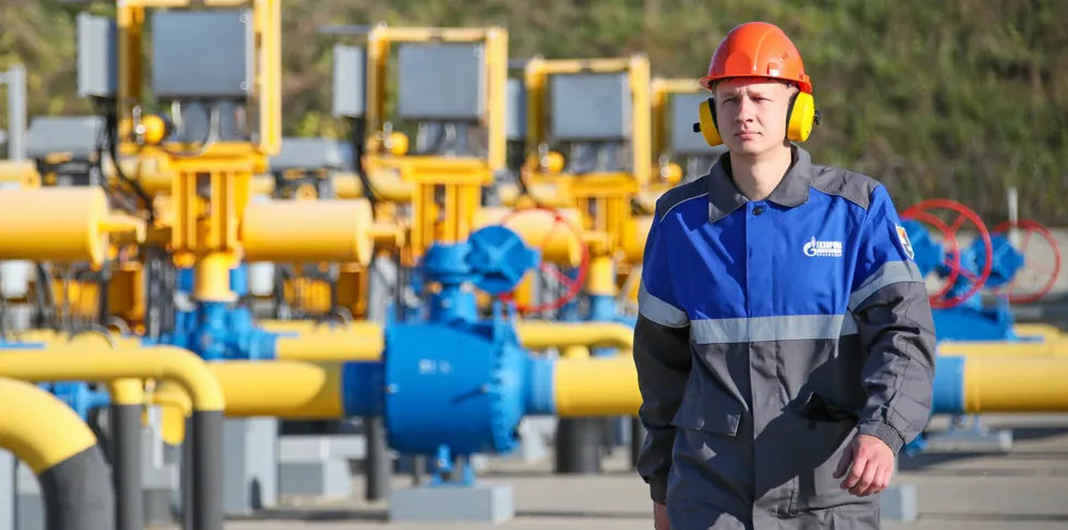 A Gazprom worker walks by a gas-measuring unit at the Russkaya Compressor Station of the TurkStream gas pipeline in southern Russia. By coincidence, the pipes, which supply gas to Eastern Europe via Turkey, were painted in the colours of the Ukranian flag.