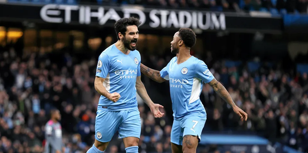 Ilkay Gundogan of Manchester City celebrates after scoring his side's third goal with Raheem Sterling.