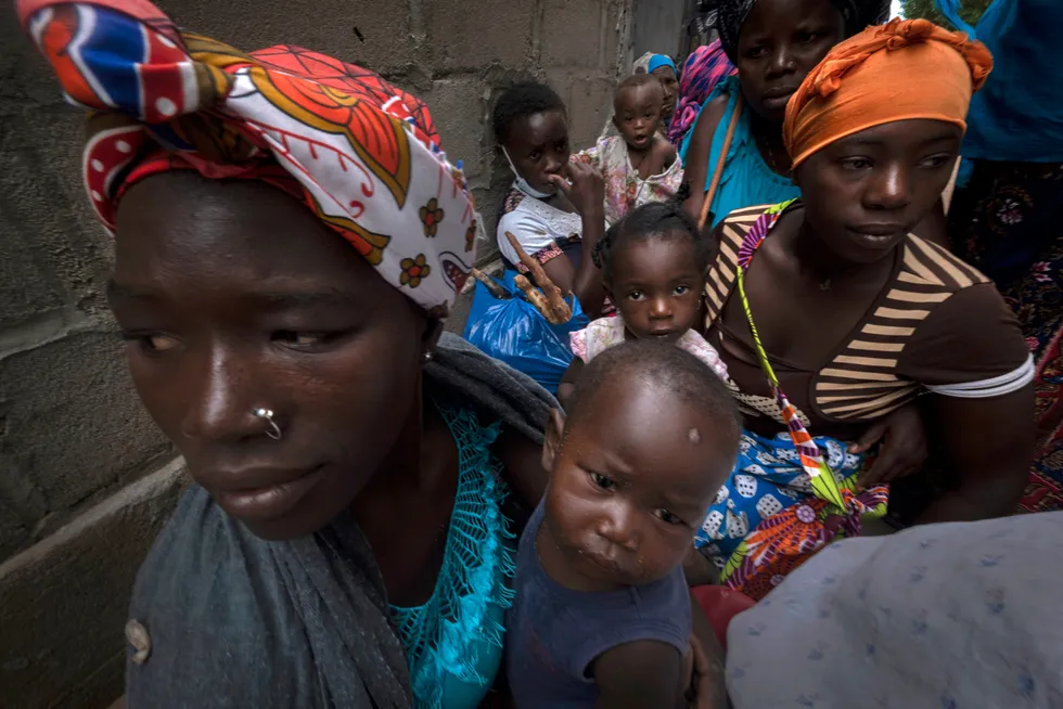 Insurgency: displaced women with their children wait for assistance at a building used by refugees as shelter in Pemba, Mozambique, after they fled attacks in Palma in northern Mozambique