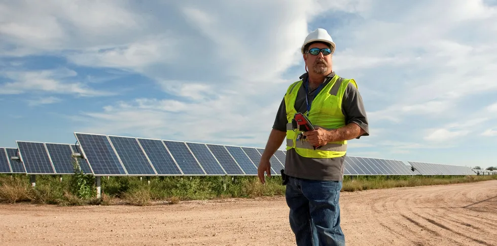 Technician at the Webberville PV farm, one of the largest active solar projects in the US