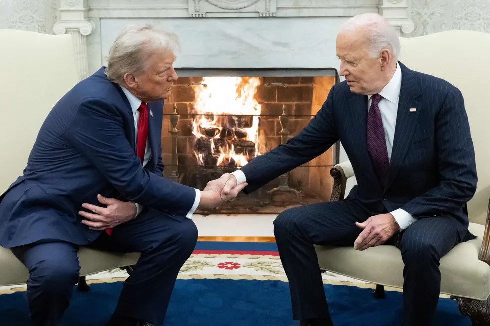 In this file photo, former US President Joe Biden shakes hands with incoming US President Donald Trump during a meeting in the Oval Office of the White House in Washington, DC, on 13 November 2024.