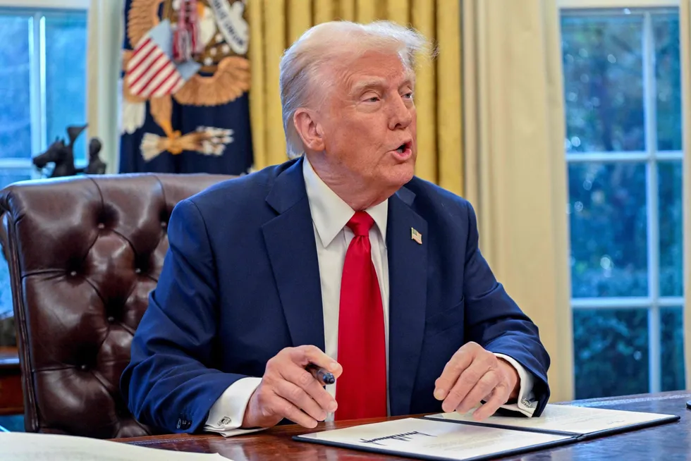 US President Donald Trump speaks to the press after signing an executive order in the Oval Office of the White House on 30 January.