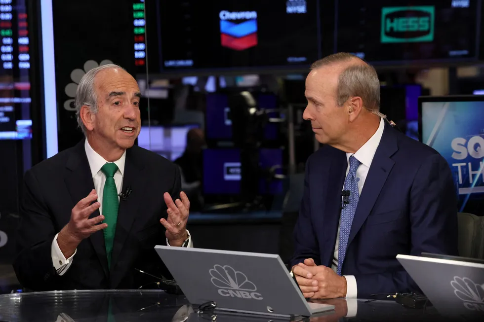 Chevron chief executive Mike Wirth (right) and Hess chief executive John Hess (ldeft) pitcured during an appearance on CNBC last year.