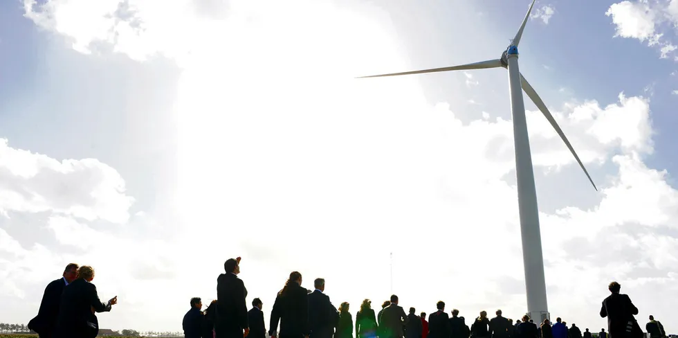 Visitors gather at the commissioning ceremony at the ECN Windturbine Testpark Wieringermeer in the Netherlands