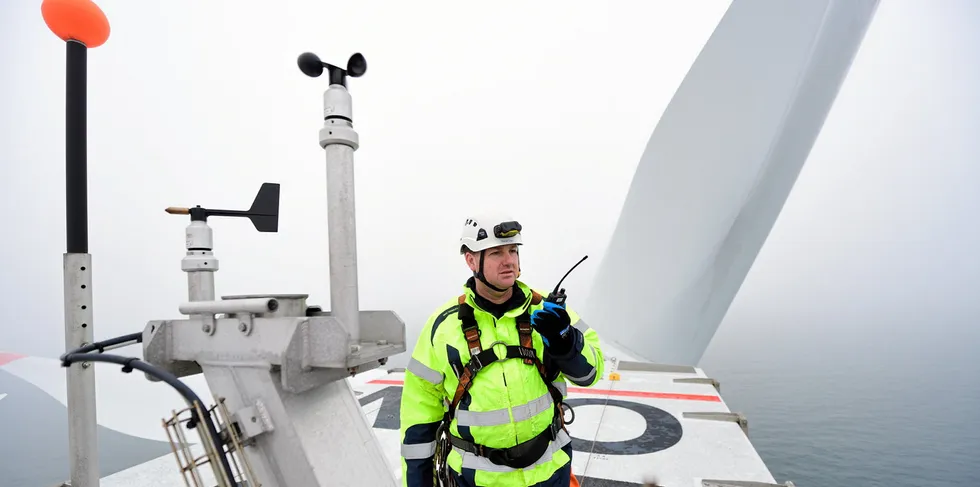 Technician on nacelle of turbine at Nordsee Ost wind farm in the North Sea
