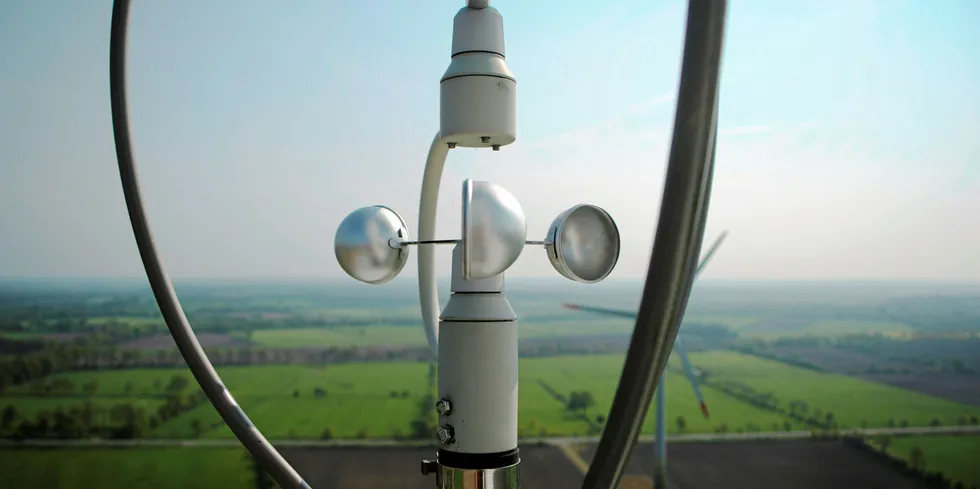 A cup anemometer measuring 'wind speed' on top of a turbine.