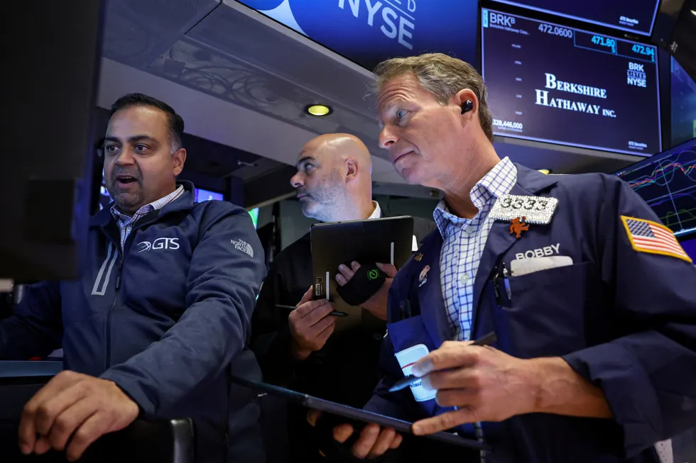 Traders work on the floor at the New York Stock Exchange (NYSE) in New York City, US, on Friday, 22 November 2024.