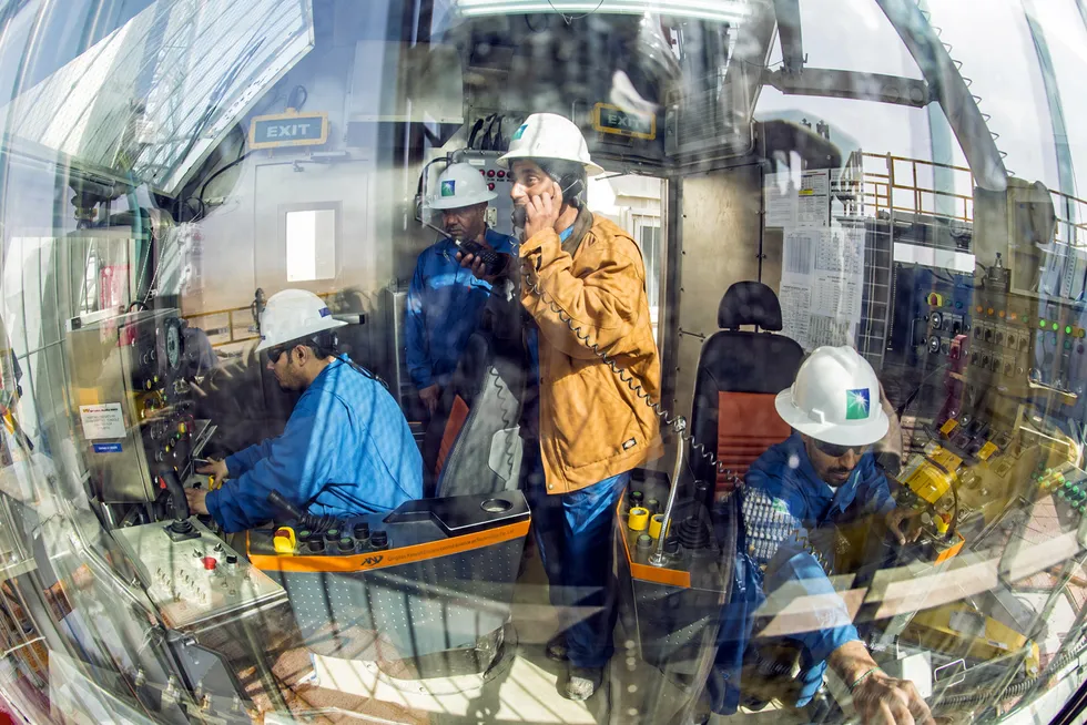 Operations: Saudi Aramco onshore rig and workers.