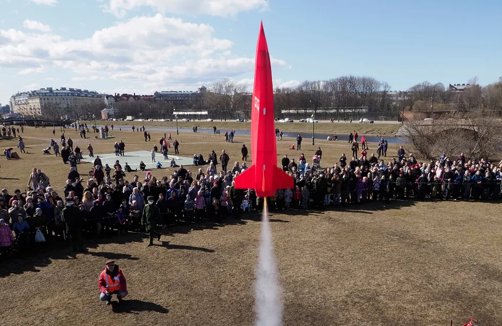 Taking off: a crowd watches the launch of a model rocket shaped in the form of Gazprom's headquarters in St Petersburg, during a celebration of the 60th anniversary of the Soviet Union's first manned flight into space