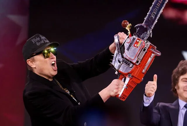 Tesla and SpaceX CEO Elon Musk wielding a chainsaw to signify his approach to trimming government spending.