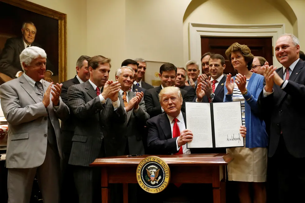 Reversal: Trmp signs order to walk back Obama-era protections