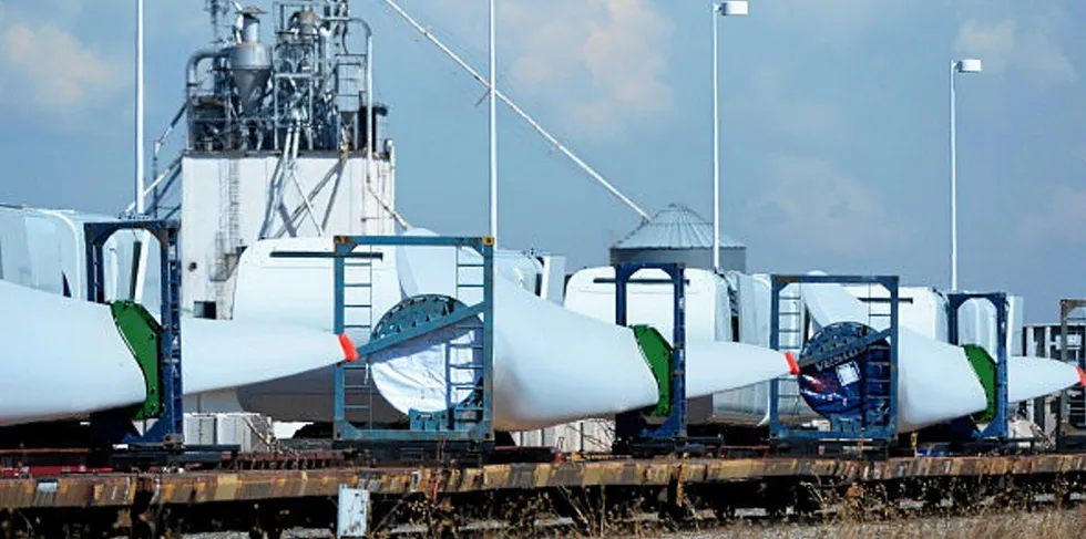 Vestas wind turbine blades loaded on a train awaiting delivery in Denver, Colorado