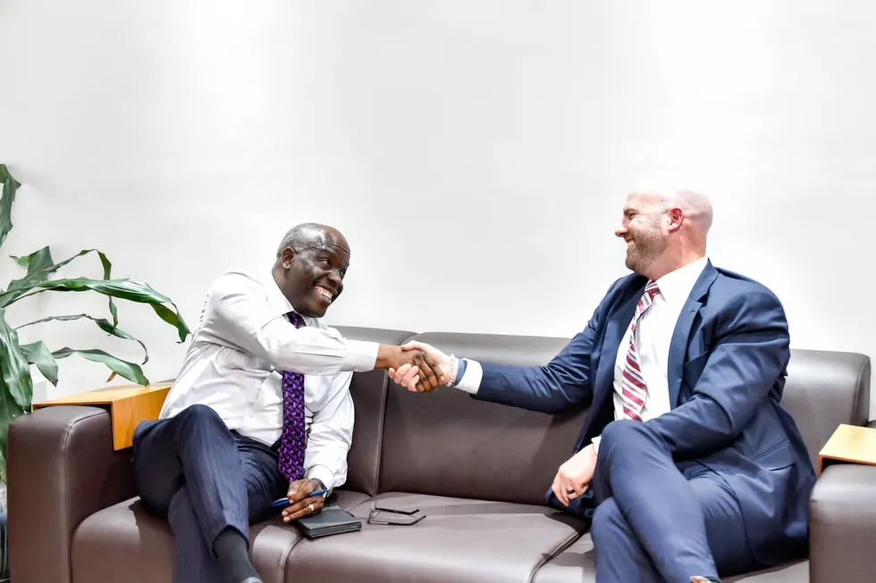 NUPCR chief executive Gbenga Komolafe (left) shakes hands with Shane Harris, ExxonMobil’s managing director for Nigeria.