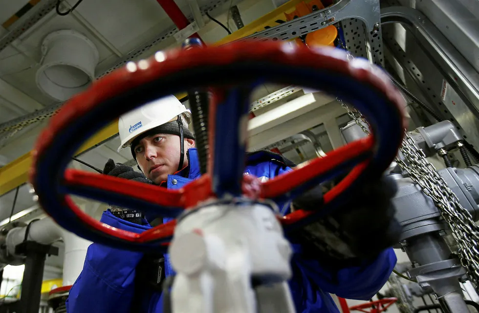 A worker of Russian gas and oil giant Gazprom works on February 18, 2015 in Novoprtovskoye oil and gas condensates oilfield at Cape Kamenny in the Gulf of Ob shore line in the south-east of a peninsular in the Yamalo-Nenets Autonomous District, 250 km north of the town of Nadym, northern Russia. For the first time 'Gazprom Neft' company implemented winter shipment of oil by sea from Novoportovskoye deposit located on the Yamal Peninsula. The first batch of raw materials in the amount of 16 thousand tons was sent to European consumers by two tankers accompanied by an icebreaker. AFP PHOTO / ANDREY GOLOVANOV . .