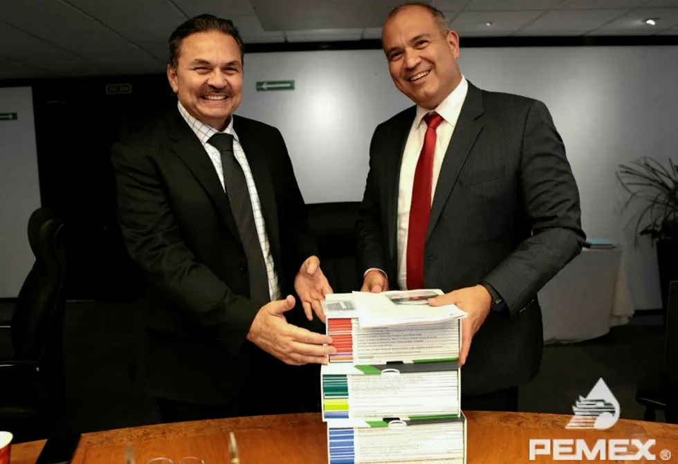Pemex handover: Incoming chief Octavio Romero Oropeza and outgoing leader Carlos Trevino Medina