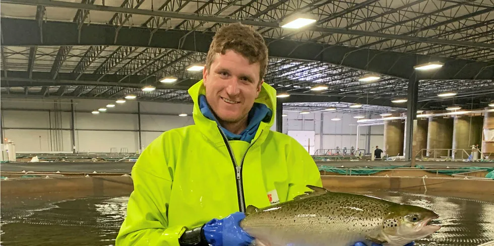Peter Bowyer, a facility manager at AquaBounty, with its first commercial land-based salmon to be sold to US consumers.