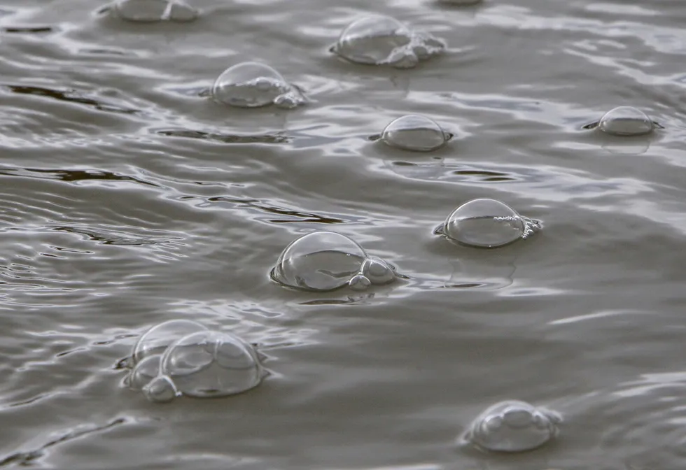 Known cause: methane gas bubbles up from underwater vents from a lake in the Mackenzie River Delta in Canada.
