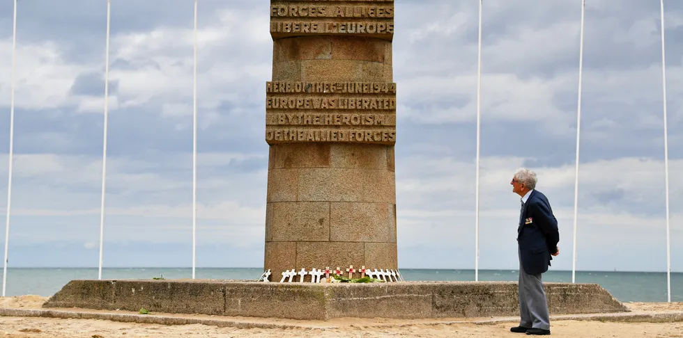 D-Day veteran Donald Hendrey looks at the monument on Juno beach at Courseulles-sur-Mer in Normandy, north-western France.