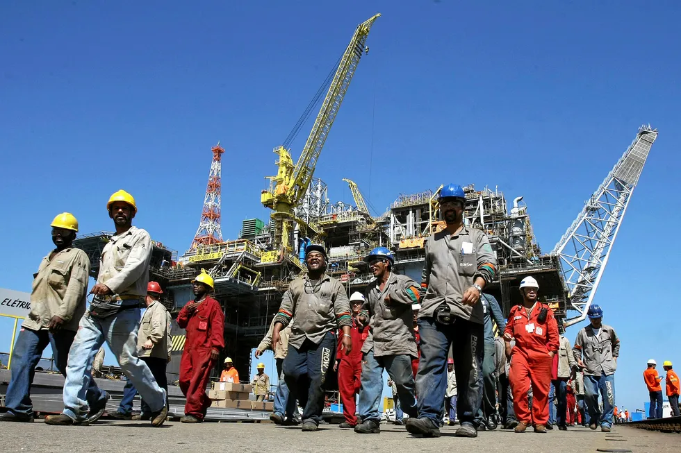 In the spotlight: workers finish their shift at a platform construction site in Brazil