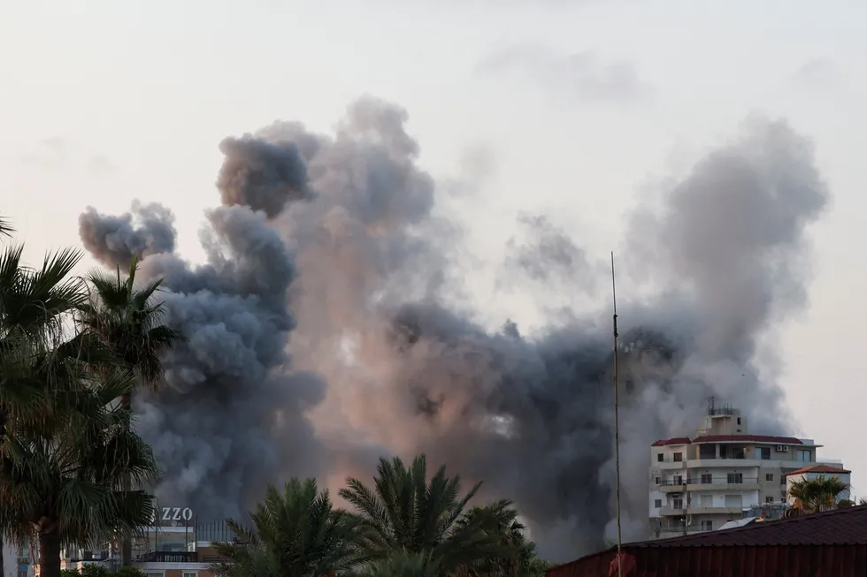 Smoke billows amid the ongoing hostilities between Hezbollah and Israeli forces in Tyre, southern Lebanon, on 7 October 2024.