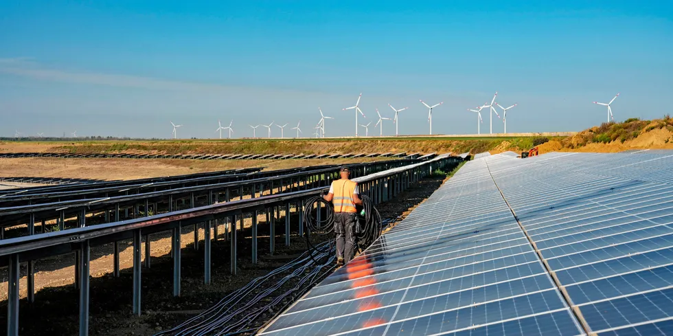 RWE solar array on with wind farm in background