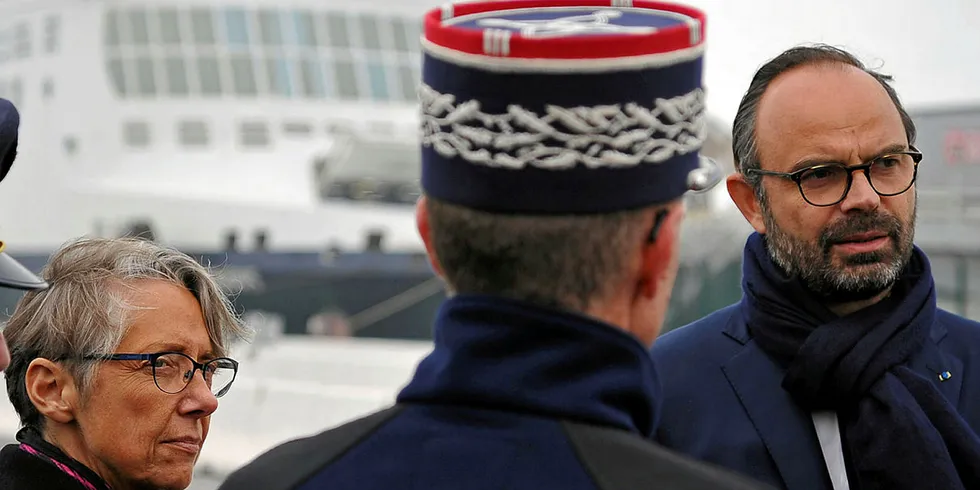 French Prime Minister Edouard Philippe (R) visits the port of Dunkirk, northern France in 2018.