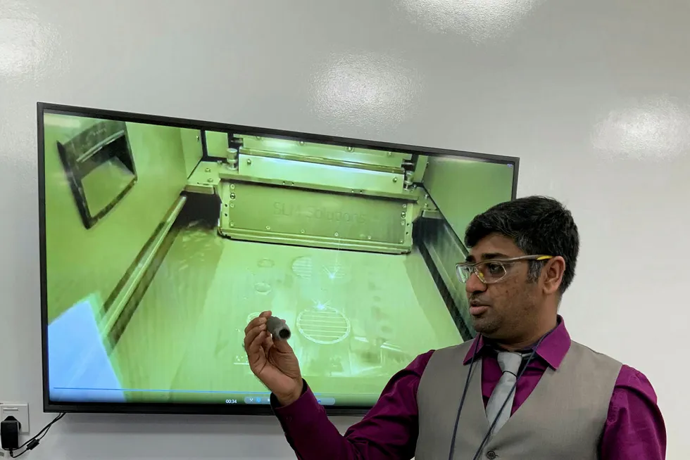 Details: a Baker Hughes scientist shows oilfield tools created with a metal 3D printer at the company’s R&D facility in Dhahran Techno Valley.