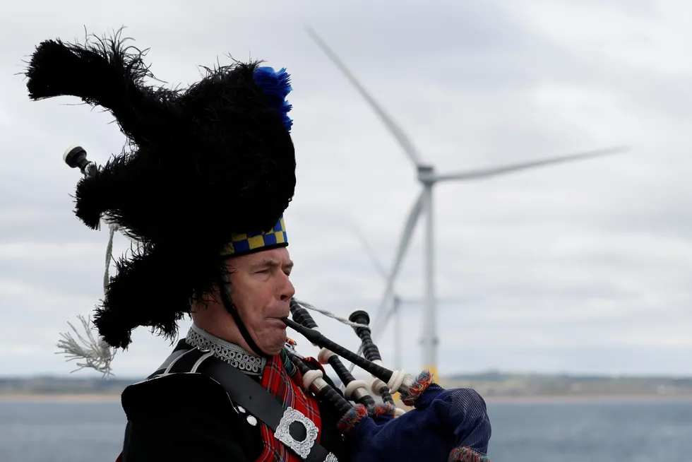 A piper plays at the 2018 inauguration of the European Offshore Wind Deployment Centre (EOWDC) offshore Aberdeen.