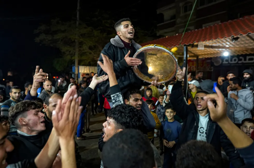 Palestinians celebrate the announcement of a ceasefire deal between Hamas and Israel in Deir al-Balah, central Gaza Strip. Analysts claimed a prolonged ceasefire in Gaza could be a “door opener” into Israel for Saudi Arabia and other key Persian Gulf oil-producing states, potentially improving business ties and leading to wider peace in the region.