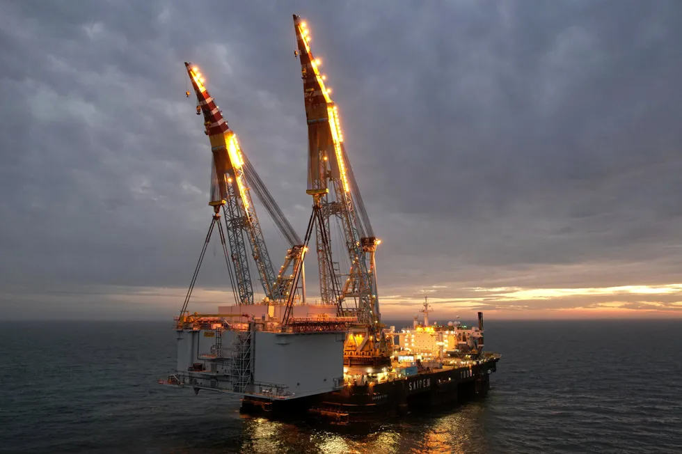 A HVDC offshore substation platform is installed on the UK's Dogger Bank wind farm by the Saipem 7000 vessel.