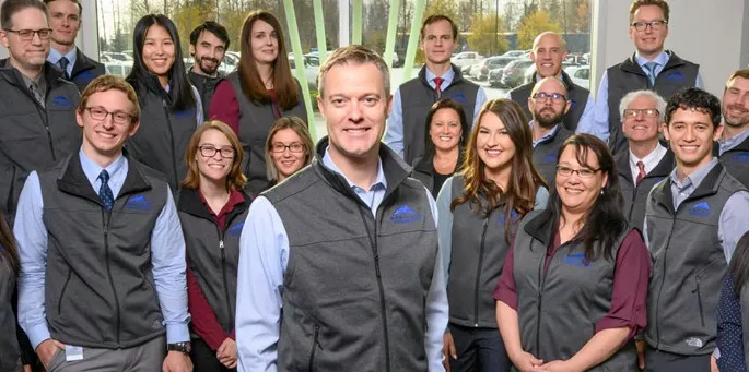 McKinley Capital Management CEO and Chief Investment Officer Rob Gillam in the foreground of his Anchorage, Alaska-based team.