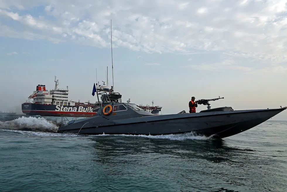 Middle East tensionL: a boat of the Iranian Revolutionary Guard sails next to Stena Impero, a British-flagged vessel owned by Stena Bulk