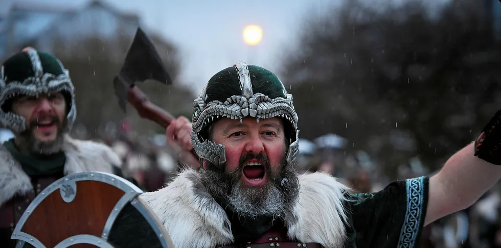 Participants dressed as Vikings parade through the streets of Lerwick, Shetland Islands.