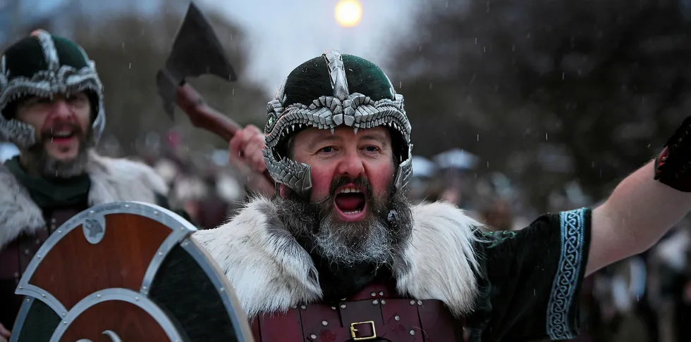 Participants dressed as Vikings parade through the streets of Lerwick, Shetland Islands