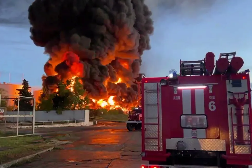 Aftermath: Firefighers next to a blaze at an oil and products storage depot on the Kazachaya Bay, near the port of Sevastopol in Russian-occupied Crimea Peninsula, on 29 April 2023.