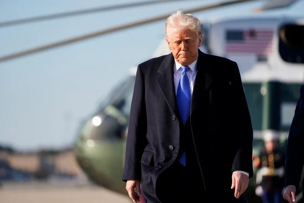 US President Donald Trump walks to board Air Force One to depart for New Jersey, at Joint Base Andrews, Maryland, US, on 21 March.