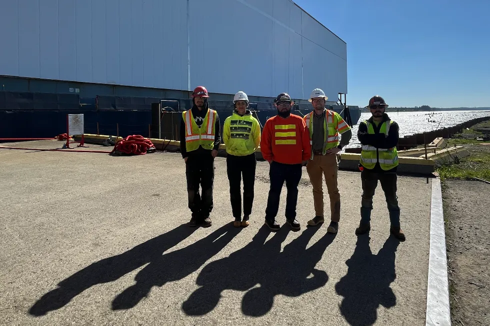 Circle team members next to the "Circle I" barge from left to right: Oscar Merino (Construction Assistant), Nimrat Gill (Field Engineer), Ricardo Oritz (Construction Assistant), Slade Rand (Project Manager) and Christian Shaw (Construction Assistant).