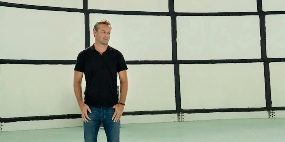 Atlantic Sapphire CEO Johan Andreassen standing inside a tank at the company's Florida Bluehouse land-based salmon facility.