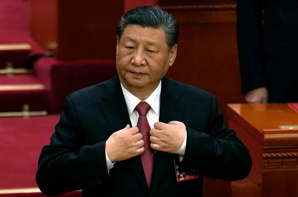 Chinese President, Xi Jinping, adjusts his jacket during the closing session of last year’s National People’s Congress in Beijing.