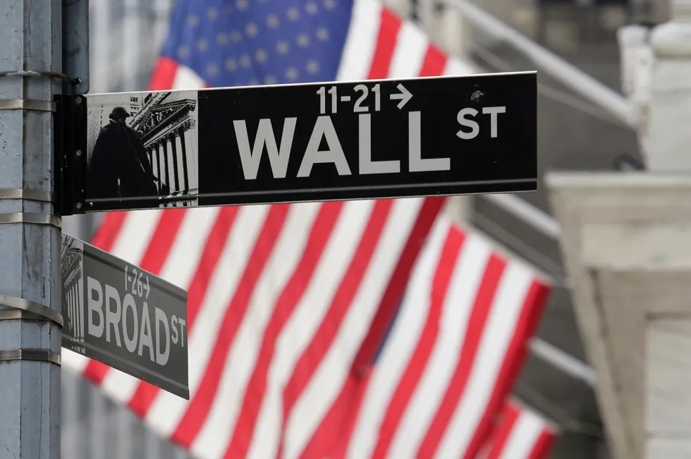 Signs marking the intersection of Broad and Walls streets appear near the New York Stock Exchange.