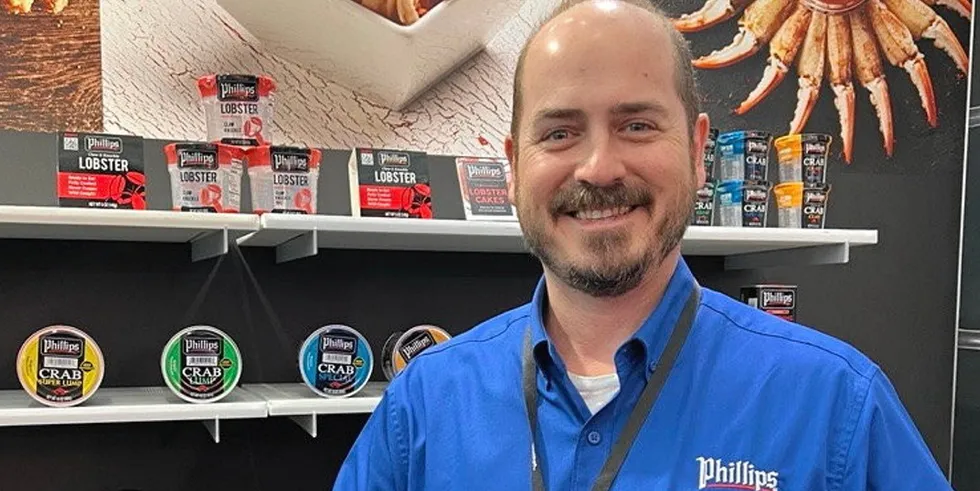 Brice Phillips, the vice president of sustainability and business development at Phillips Foods, showing off the company's new lobster products at the Boston Seafood Expo in March.