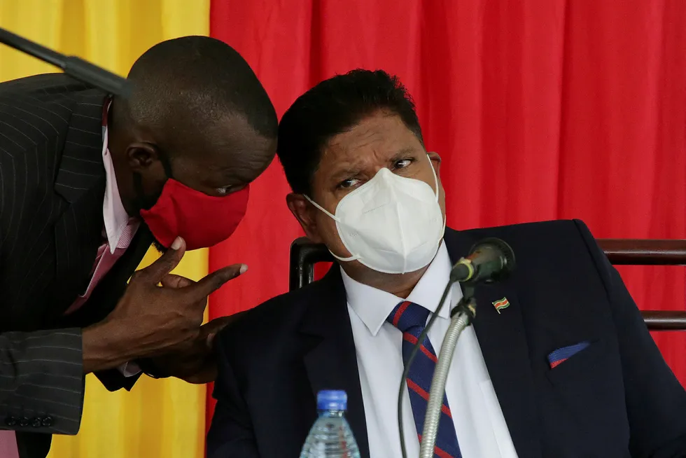 Spud pending: recently elected President Chandrikapersad Santokhi listens to an aide during a news conference in Suriname's capital city, Paramaribo
