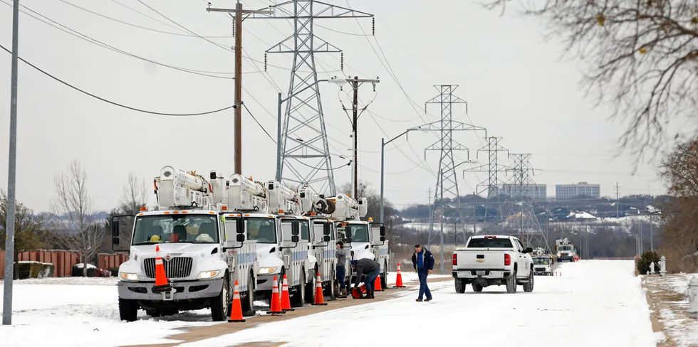 Electric service trucks line up after severe weather knocked out much of the Texas power grid last week.