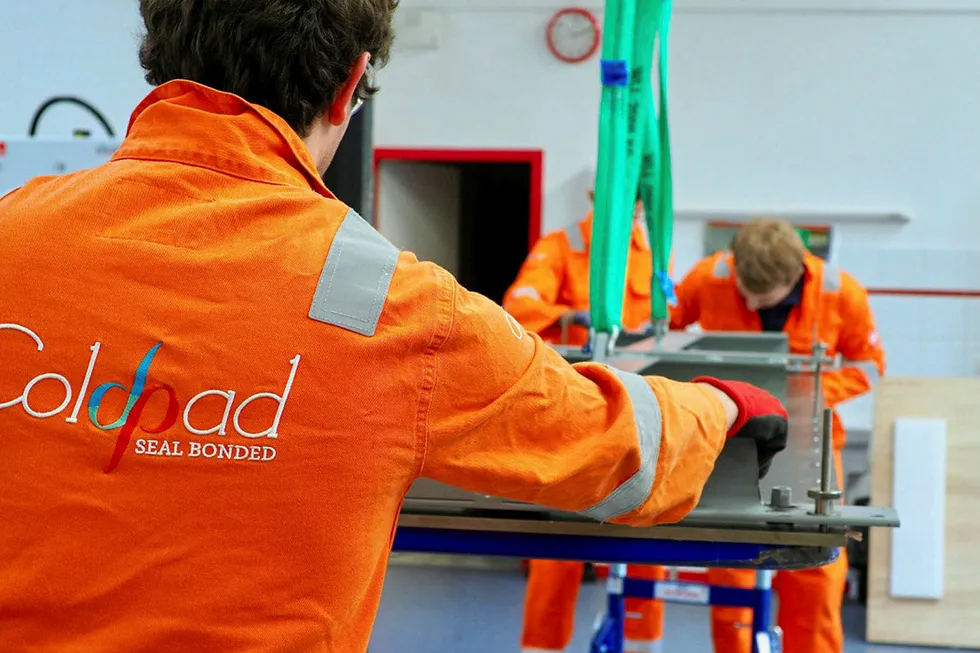 Bonding moment: ColdShield technicians prepare bonded composite reinforcements for the FPSO deck repair