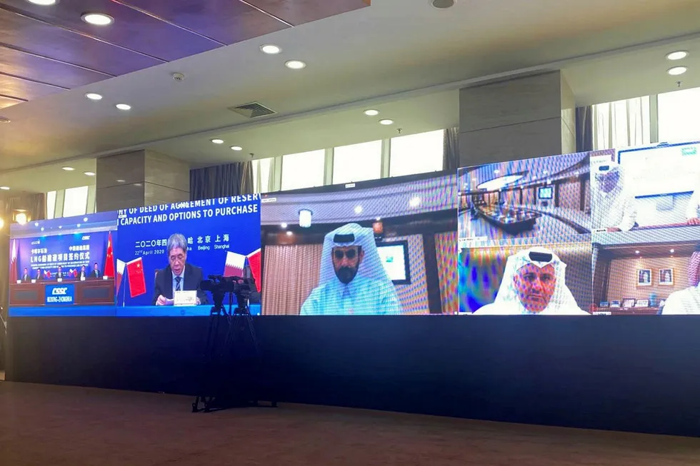 Deal: Qatari and Chinese officials signing a mega LNG ships construction deal through a virtual ceremony