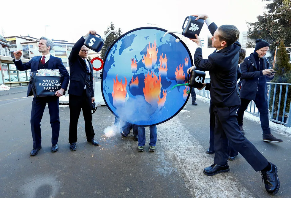 In flames: demonstrators protest for action against climate change during the World Economic Forum meeting in Davos, Switzerland this week